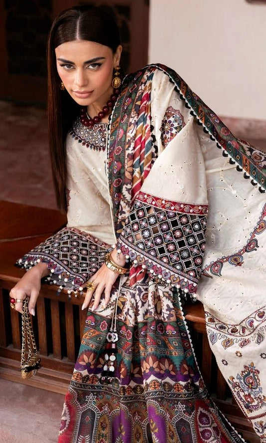 Model wearing a Jazmin Shahkaar cream-colored premium luxury lawn 3-piece suit featuring dark maroon and purple traditional geometric embroidery on wide-sleeves and pants, paired with a patterned multi-color digital print dupatta
