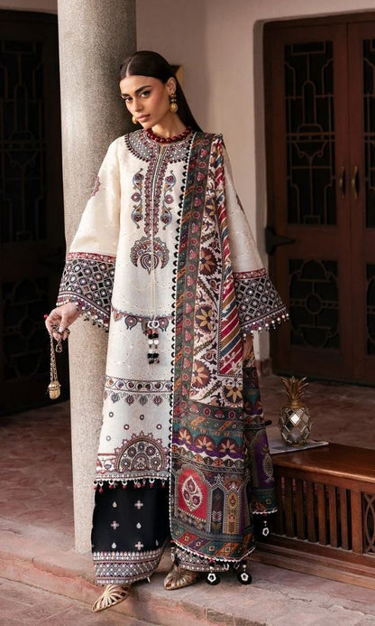 Model wearing a Jazmin Shahkaar cream-colored premium luxury lawn 3-piece suit featuring dark maroon and purple traditional geometric embroidery on wide-sleeves and pants, paired with a patterned multi-color digital print dupatta
